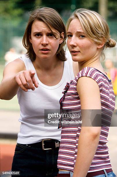 Germany: Free time.- Two woman being amazed.