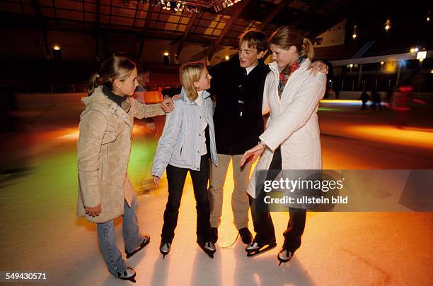 Germany: Free time.- Youth skating in an ice-skating rink.