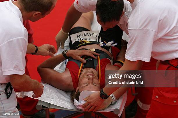 Germany, Frankfurt: Ironman. - Medical care for one of the particiants.