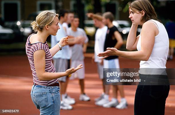 Germany: Free time.- Tow women talking about basketball.