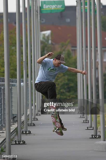 Germany: Young persons in their free time.- A young man is riding a skateboard.