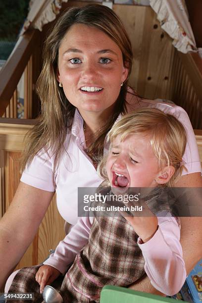 Germany, Essen: Portrait of a young mother with her little daughter.