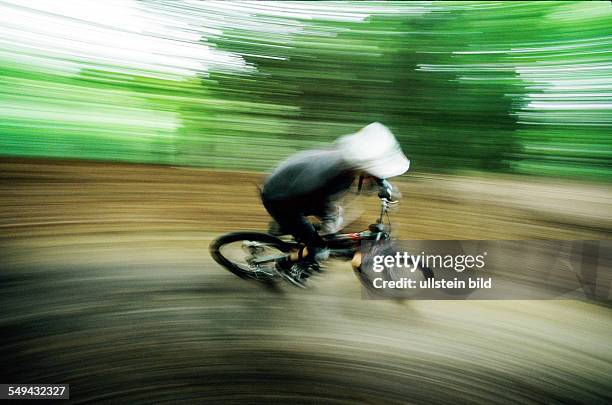 Germany: Free time.- Cyclists in the wood.