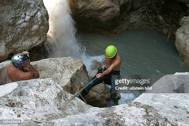 Turkey: Men during a climbing tour; at a mountain lake.