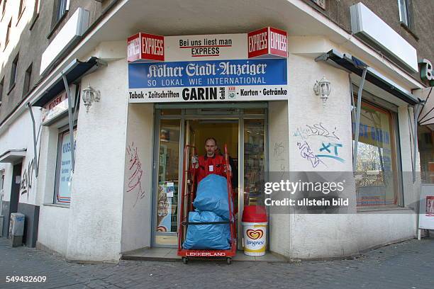 Germany, 2003: Deposit.- Turkish market; bin liners filled with empty bottles and tins are collected.