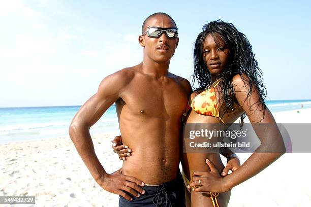 Cuba: Portrait of a Cuban couples at the beach.