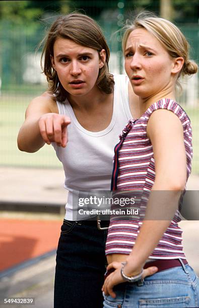 Germany: Free time.- Two woman being amazed.