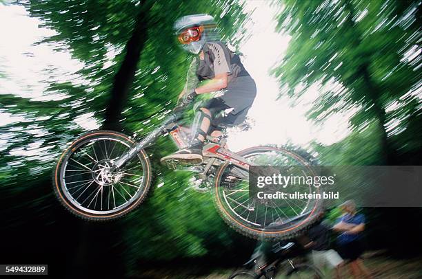 Germany: Free time.- Cyclists in the wood.