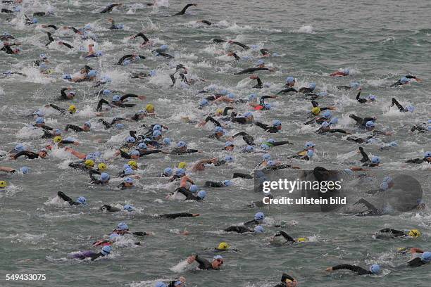 Germany, Frankfurt: Ironman. - Look at the competitors while they are swimming.