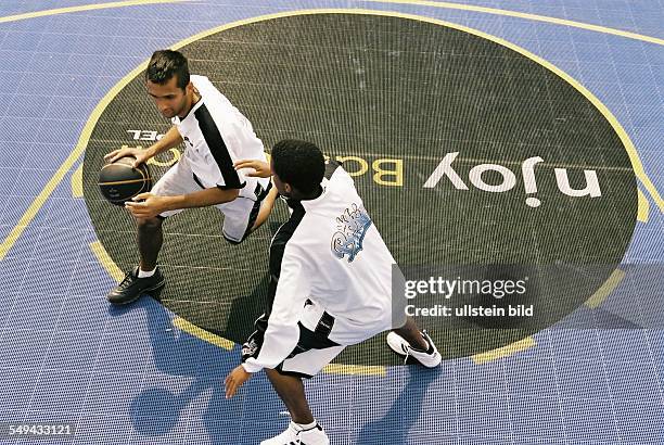 Germany, Cologne: Opel-Challenge-Final. - Look from above at two players and the field.