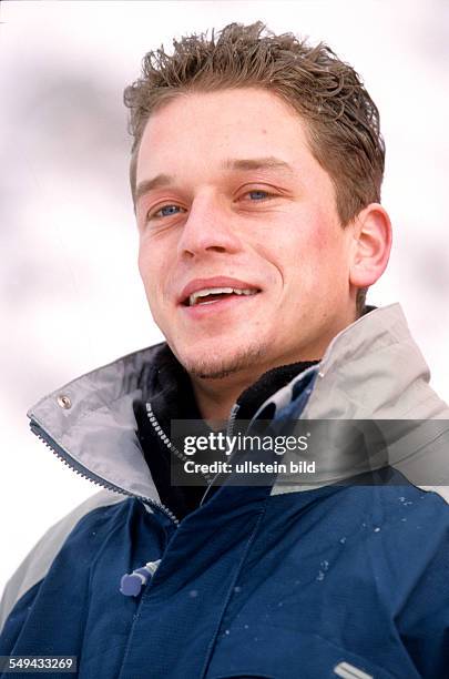 Germany: Free time.- Portrait of a young woman in the snow.