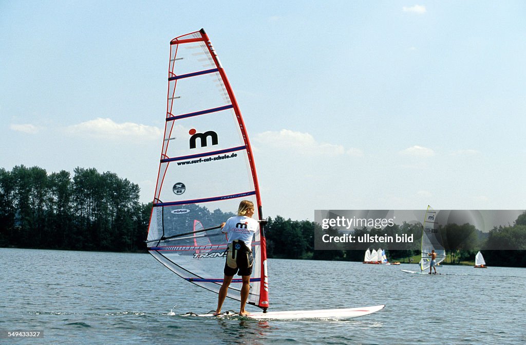 DEU, Germany: Free time.- Young man surfing.