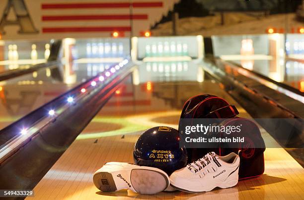 Germany: Free time.- At a bowling alley; shoes, ball and rucksack.