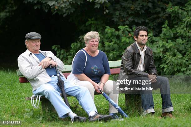 Germany, Hagen, Senior citizen, People sitting on a bench;