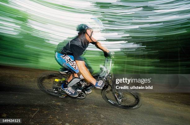 Germany: Free time.- Cyclists in the wood.