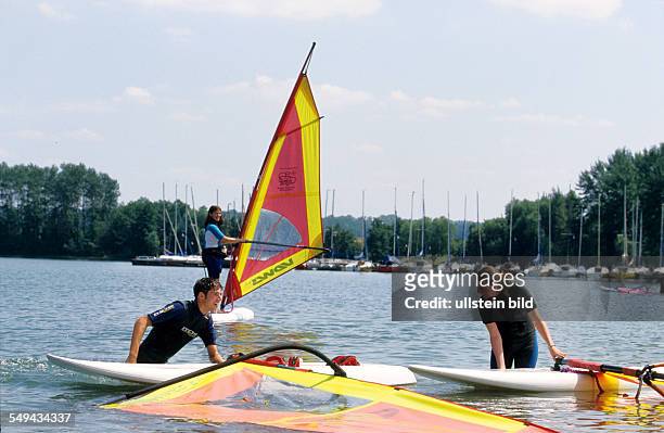 Germany: Free time.- Young persons surfing.