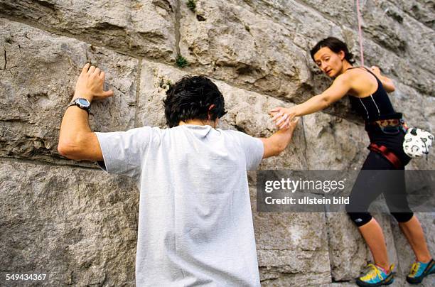 Germany: Free time.- Young persons climbing.