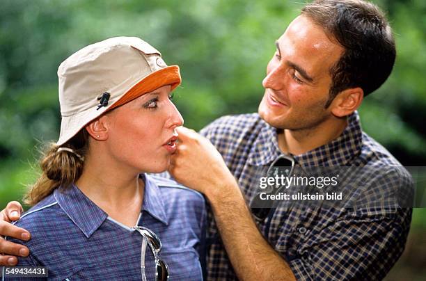 Germany: Free time.- Two young persons talking.