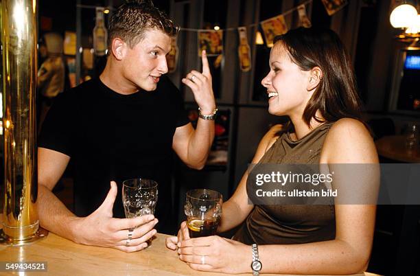 Germany: Free time.- Young persons bowling; at the bar.