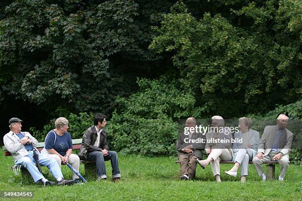 Germany, Hagen, Senior citizen, People sitting on a bench;