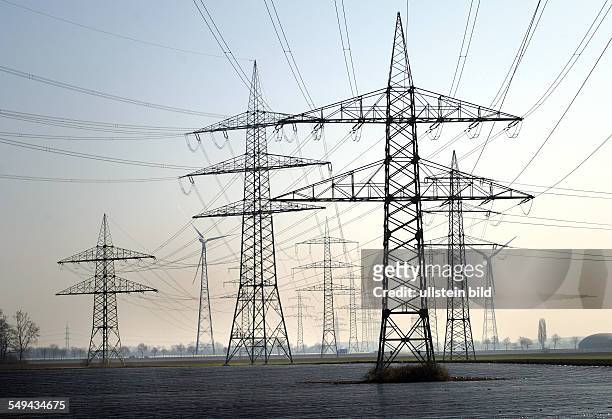 Power Poles of RWE AG between asparagus fields which are covered with foil