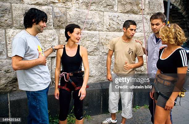 Germany: Free time.- Young persons after climbing.