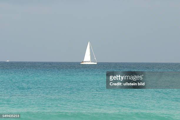 Cuba: A sailing boat on the sea.