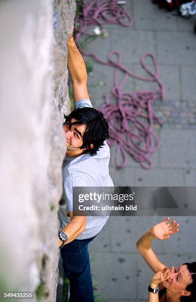 Germany: Free time.- Young man climbing.