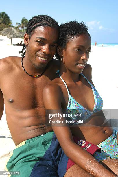 Cuba: Portrait of a Cuban couple at the beach.