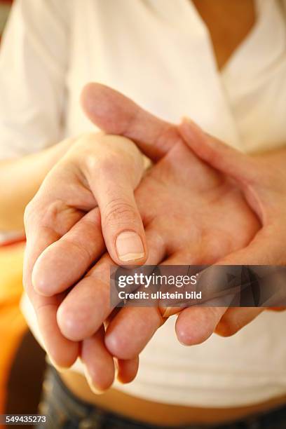 Germany: Therapy. A patient during the therapy for the hands.