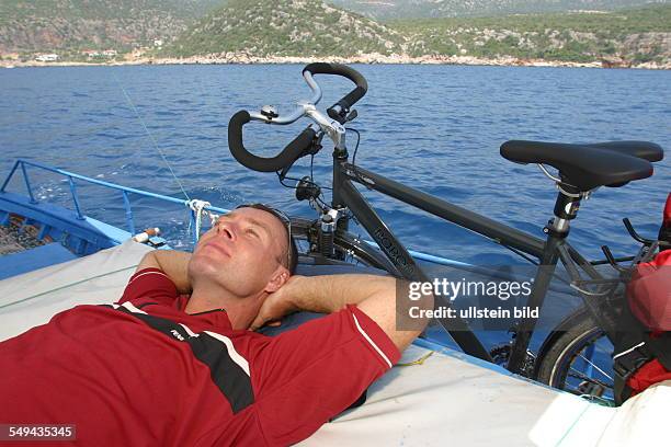 Turkey: A man during a boat trip on the sea.