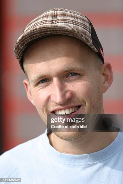 Germany: Young persons in their free time.- Skateboarding; Portraet of a young man.