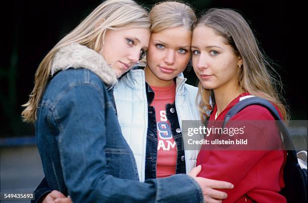 Germany: Free time.- Portrait of a three girlfriends.
