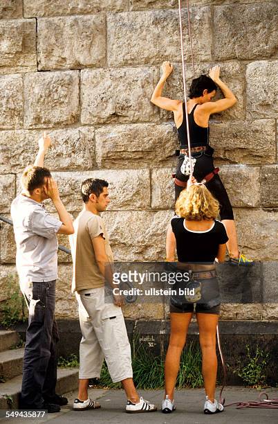 Germany: Free time.- Young persons climbing.