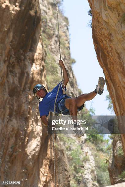 Turkey: A man during a climbing tour in the mountains.