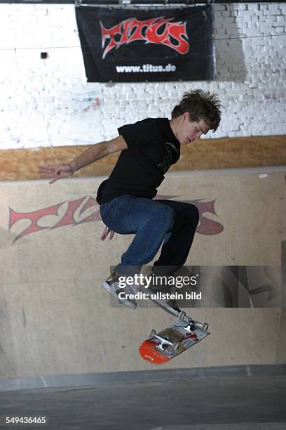 Germany: TITUS. - Portrait of a young man while he is skateboarding.