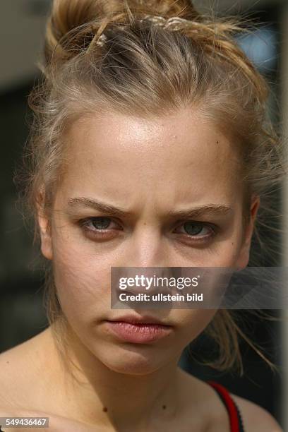 Germany, Cologne: Youth in their free time.- Portrait of a young woman.