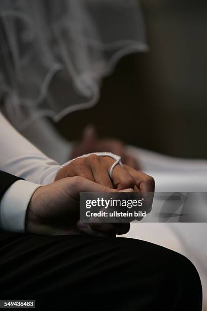 Germany: The wedding couple in front of the altar.