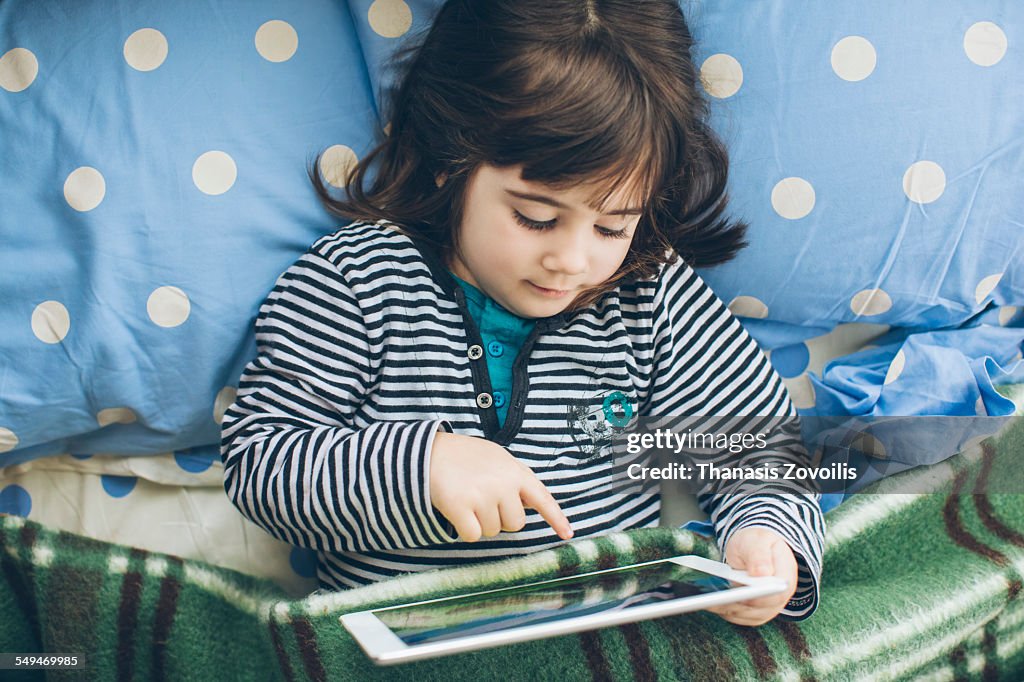 Small girl using a digital tablet