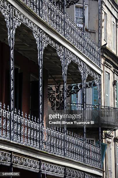 wrought iron balcony in french quarter - new orleans architecture stock pictures, royalty-free photos & images