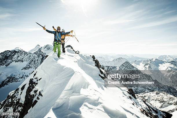 success - climbing snow mountain imagens e fotografias de stock