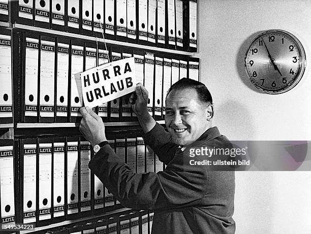 Germany, office clerk starting into vacastion. In the 1960's