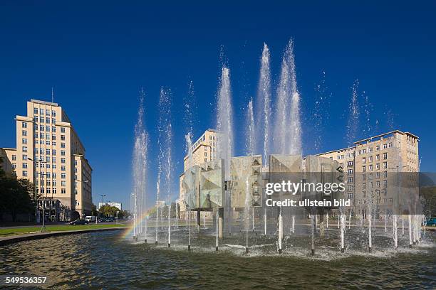 Germany - Berlin - Friedrichshain-Kreuzberg : the DDR era fountain at square "Strausberger Platz" with the street "Karl-Marx-Allee"