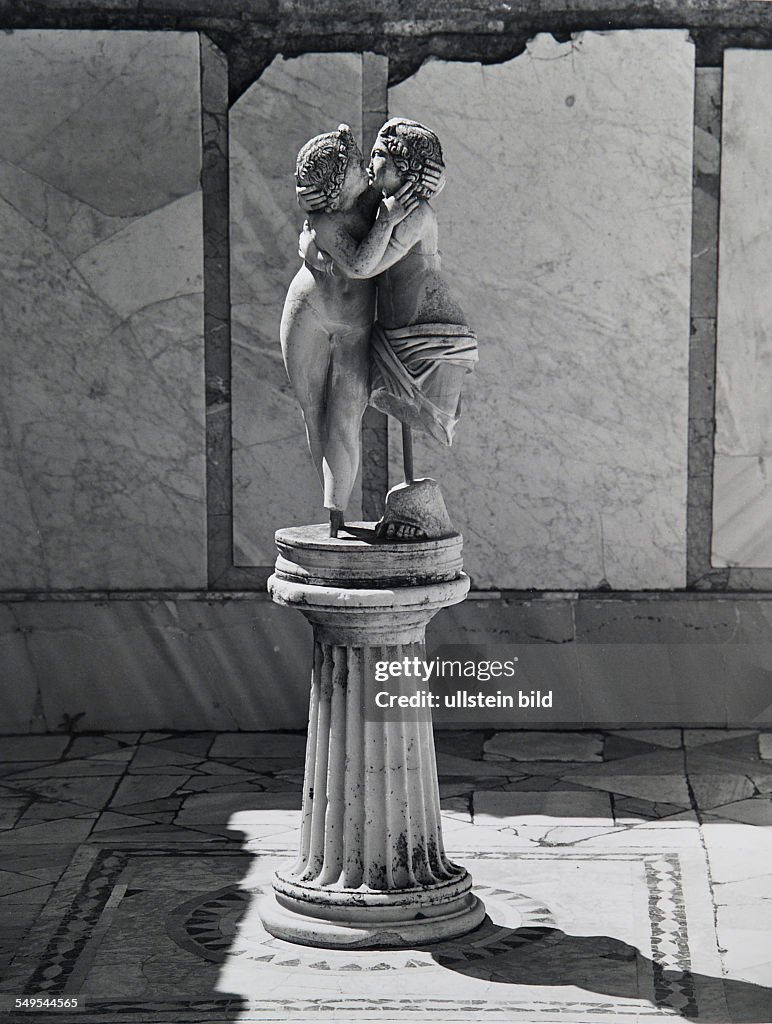 Italy, Rome, Ostia Antica, antique Roman sculpture of god Amour and Psyche.