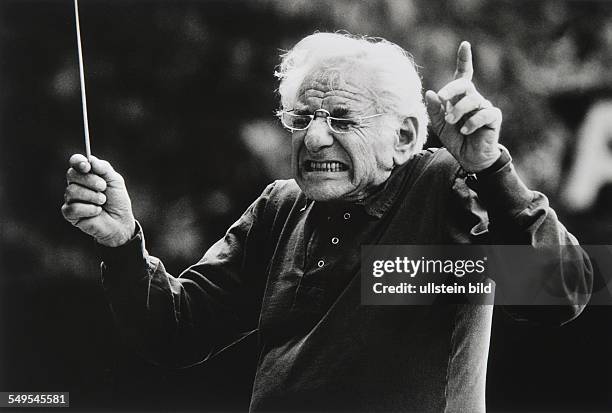 Germany, Eutin, conductor Leonard Bernstein showing expression of disgust about wrong tone