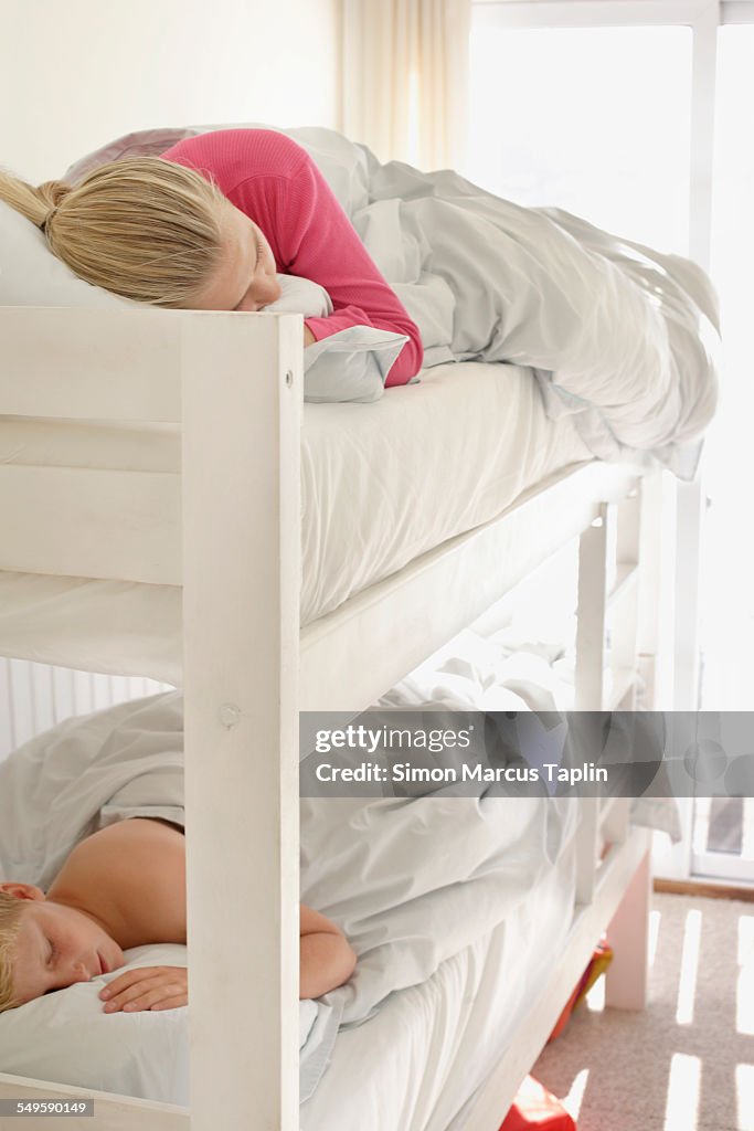 Brother and Sister Sleeping in Bunk Beds