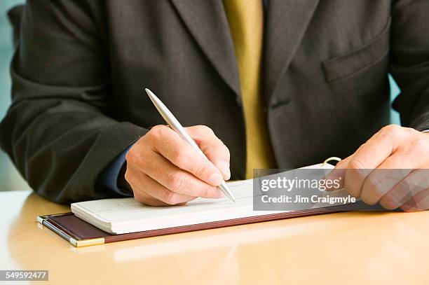 Man Write Check Business Man Writing A Check Photos and Premium High Res Pictures ...