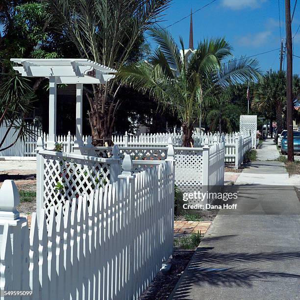 white picket fence and sidewalk - white picket gate stock pictures, royalty-free photos & images