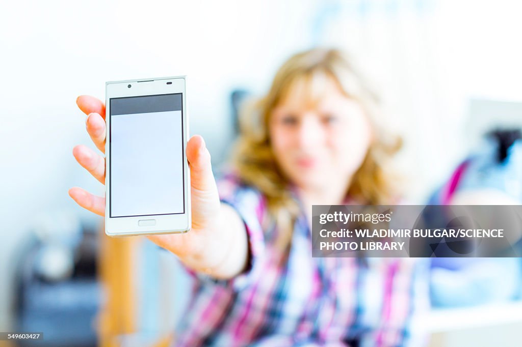 Woman holding smartphone