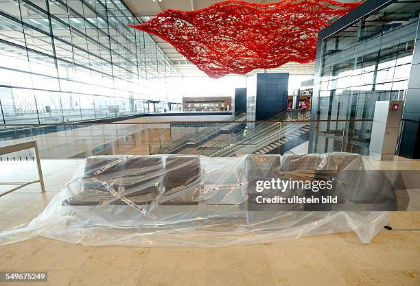 The airport Berlin Brandenburg Willy Brandt BER , to be opened in October 2013 : in the terminal building the seats are still covered with plastic...